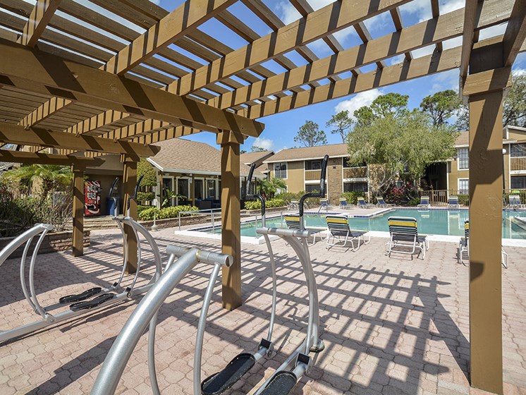 Outdoor Pool with Sundeck and Elliptical Machines